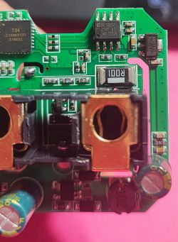 PCB from QNCX Smart Plug Close-up of a PCB from a QNCX smart plug with visible electronic components.