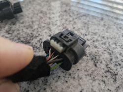Photo of an electrical connector with a wiring harness.