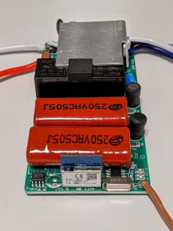 CB2S Module PCB with Capacitors PCB with electronic components, including a CB2S module and two large capacitors.
