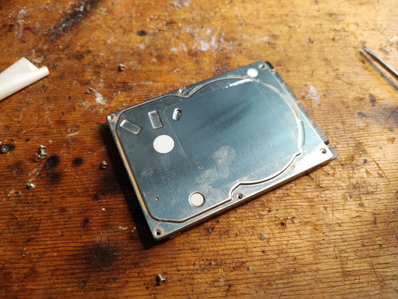 Hard Drive on a Workshop Table Hard drive on a wooden table