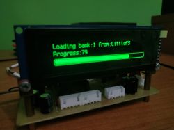LCD on a circuit board shows “Loading bank:1 from:LittleFS” and a progress bar at 79