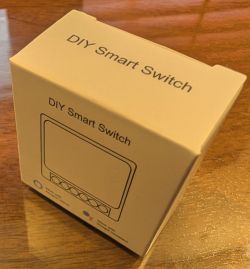 Box labeled “DIY Smart Switch” on a wooden table