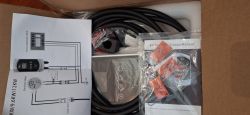 EV Charger Kit Contents Contents of EV charger box with manuals and accessories.