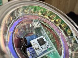 Close-up of the interior of a GU10 LED bulb with visible electronics.