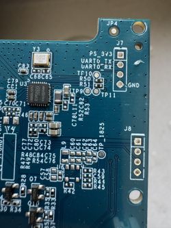 Close-up of a circuit board with visible components and markings.