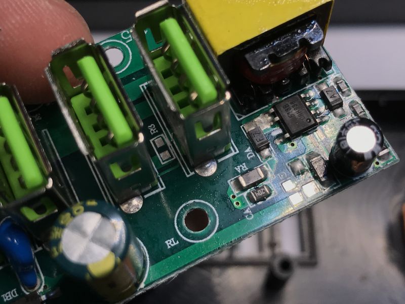 Close-up of a circuit board with USB ports and electronic components