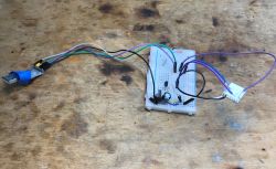 Breadboard Prototype with USB Adapter Electronic prototype on a breadboard with wires connected to a USB adapter.