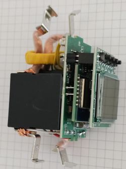 View of an electronic module with display, coils and copper wires