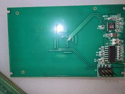 Printed circuit board with electronic components and traces.