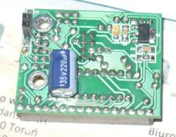 Printed Circuit Board with 220uF Capacitor Printed circuit board with a 220uF capacitor and mounting holes.