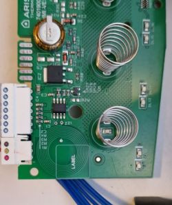 Green PCB with coil springs and electronic components
