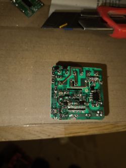 Close-up of green printed circuit board with visible surface-mount components