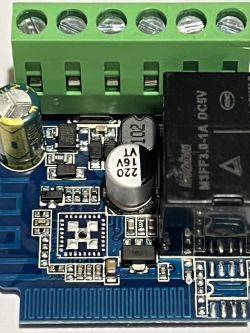 Close-up of a PCB fragment with electronic components and a T34 chip.