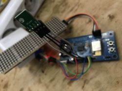 AM2301 sensor module connected to an ESP8266 board on a workbench