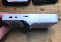 White side of R36S console with TF2-GAME card slot and small buttons visible