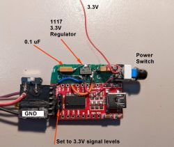 Electronic circuit with labeled components: 3.3V regulator, 0.1 uF capacitor, power switch, and GND port.