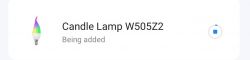 Image of a candle-shaped bulb with colorful gradient lighting. Caption: Candle Lamp W505Z2 Being added.