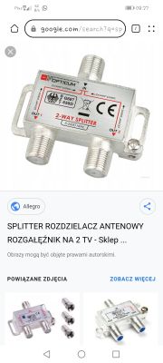 Srebrny rozdzielacz antenowy Opticum, model 2-Way Splitter, z trzema złączami i oznaczeniami częstotliwości 5-2450 MHz.