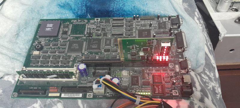Computer motherboard with a diagnostic POST card showing red LED digits