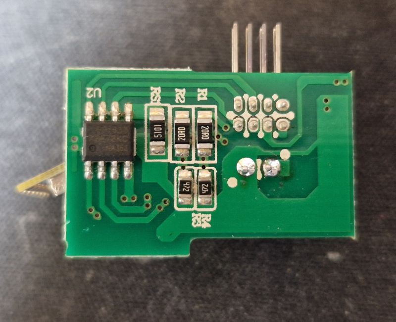 WiFi Module with Integrated Circuits Electronic module with visible integrated circuits and resistors.
