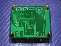 Green PCB with visible traces and mounting holes, 3D rendering