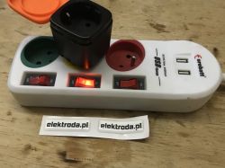 Eurobatt power strip with connected adapter and activated switch.