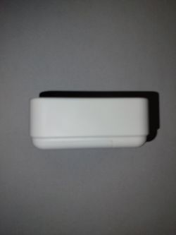 White temperature and humidity sensor on a gray background.