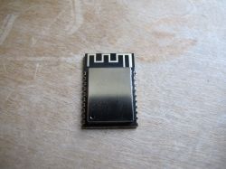 MQLinks wifi module on a wooden surface.
