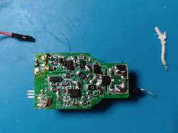 Image of a printed circuit board (PCB) with various electronic components on a blue background.