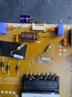 Circuit Board with Replaced Electronic Components Image of a circuit board with replaced capacitors and resistors.