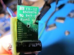 Close-up of an electronic module with visible component labels.