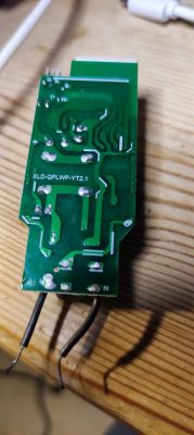 XLD-QFLWP-YT2.1 PCB with Visible Traces View of a PCB labeled XLD-QFLWP-YT2.1 with various conductive traces, set against a wooden surface.