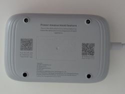 Bottom of Wi-Fi power strip with technical details and two QR codes visible.