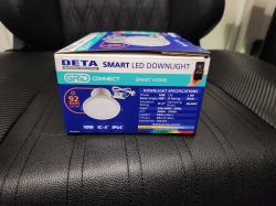 DETA 10W Smart LED Downlight Box Box of DETA 10W Smart LED Downlight on a black surface.