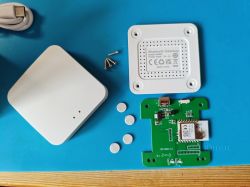 Disassembled Bluetooth gateway module with visible circuit board and casing.