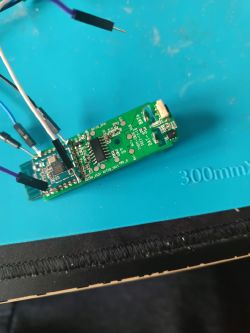 Image of a PCB with connected wires on a blue surface.