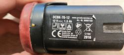 DCBK-70-12 12V 1.5Ah Battery Close-up of DCBK-70-12 battery with 12V and 1.5Ah capacity, showing manufacturer's label.