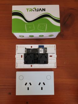 View of Shawader Smart WiFi switch PCB and packaging with Trojan logo.