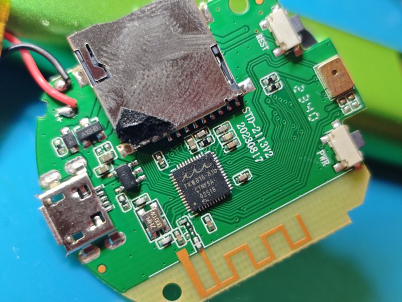 Close-up of a PCB with electronic components and a micro USB port