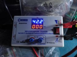 Multipurpose tester with a display showing 42.2 V and 0 mA.