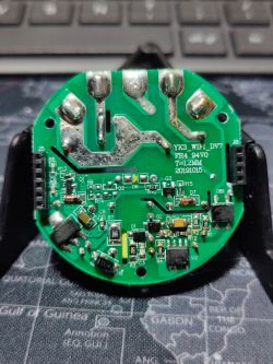 Round Printed Circuit Board with Electronic Components Close-up of a round printed circuit board with various electronic components.