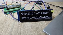 LCD display showing information about the song I Don't Like Mondays by The Boomtown Rats, connected to a set of wires.