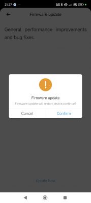 Firmware update screen with a message about performance improvements and device restart.