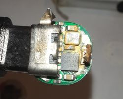 Interior of AA Battery with LC9205D Converter Image of the interior of an AA battery with a visible lithium-ion cell and LC9205D converter.