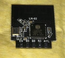 Electronic module on yellow fabric background.