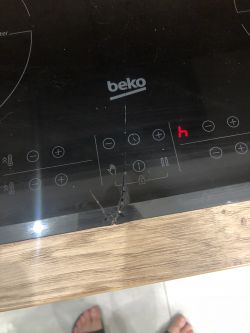 Indukcja Beko HII64205 - pęknięte szkło, możliwość zabezpieczenia, ryzyko zwarcia