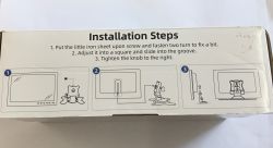 Side of a box labeled “Installation Steps” with three drawings showing how to mount a monitor stand