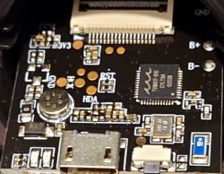 Close-up of a circuit board with electronic components and a USB port