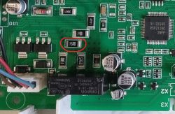 Circuit Board with Electronic Components Circuit board with various electronic components, including resistors, capacitors, and an integrated circuit.