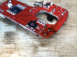 Inside View of BW-MO2 Mouse with Circuit Board Circuit board from inside the BW-MO2 mouse on a wooden background